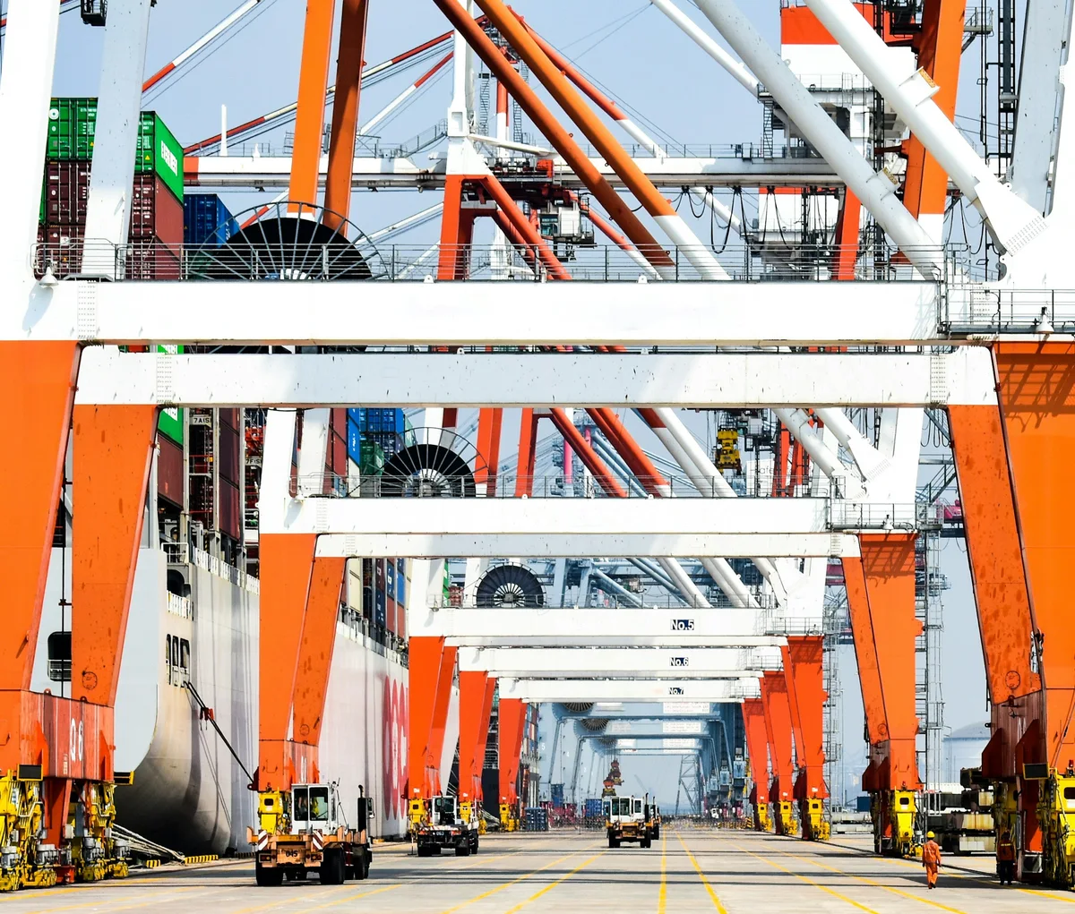 Container ship and cargo cranes at an international port
